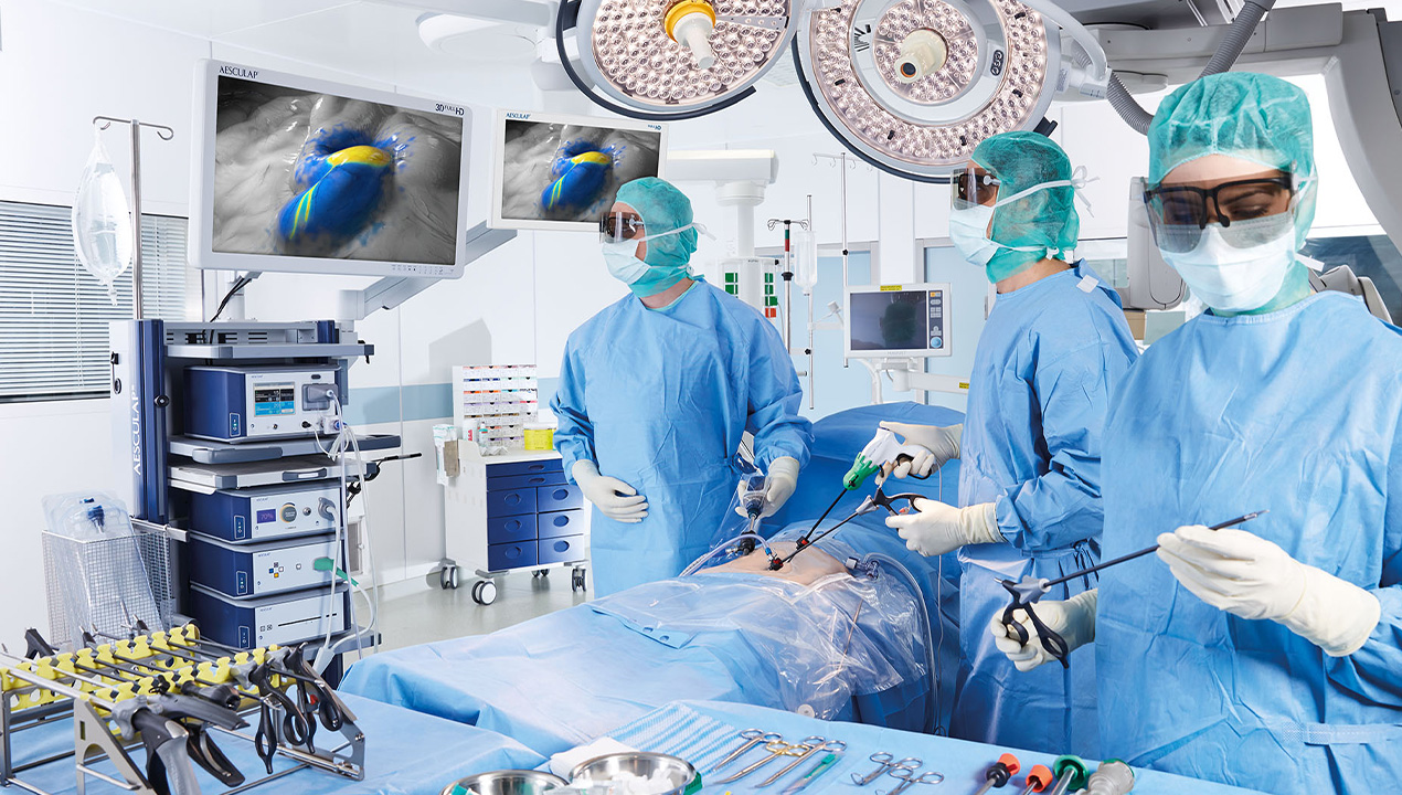 The nurse talks to a patient at the bedside